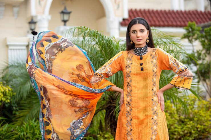 beautiful-girl-posing-confidently-landscape-waving-dupatta-wearing-desi-dress-garden_658768-471